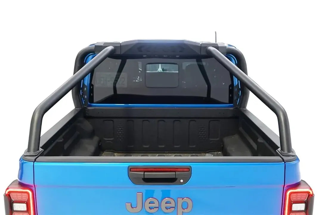Fab Fours sport rack over the empty bed of a blue Jeep Gladiator, rear view over the tailgate
