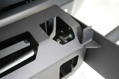 Fab Fours winch mount, close-up detail, showing the black powder-coated steel plate, mounting cutout and bracket hardware