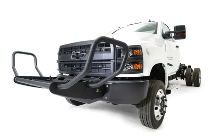 Fab Fours winch mount on a white Chevrolet Silverado 4500 chassis cab, driver-side front three-quarter view, showing the tube guard, winch tray and lower bumper