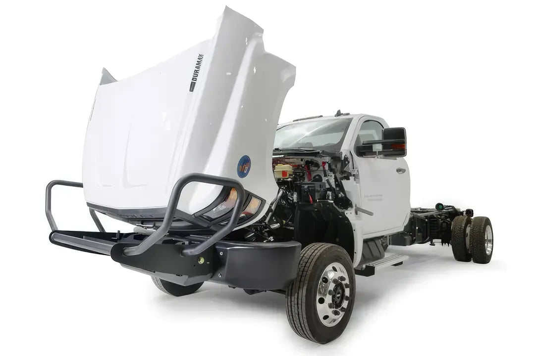 Fab Fours winch mount on a white Chevrolet Silverado 4500 chassis cab, driver-side front three-quarter view with hood open, showing the tube guard, winch mount and steel base