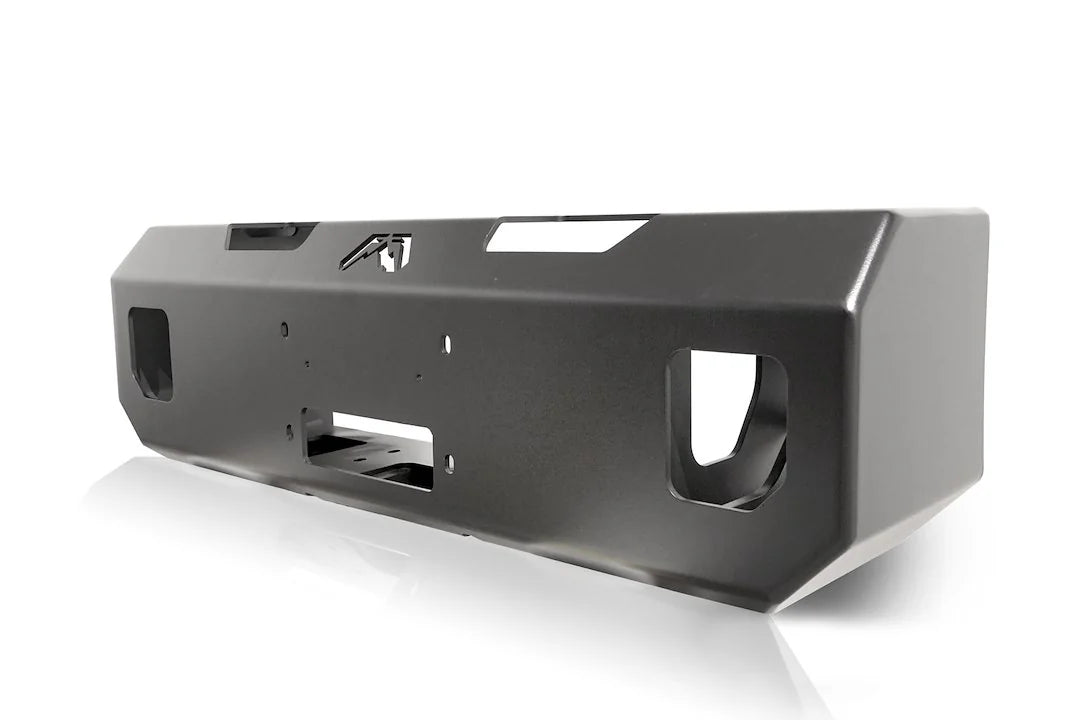 Fab Fours winch mount in black powder coat, angled view, showing the fairlead opening, tow-point cutouts and top logo