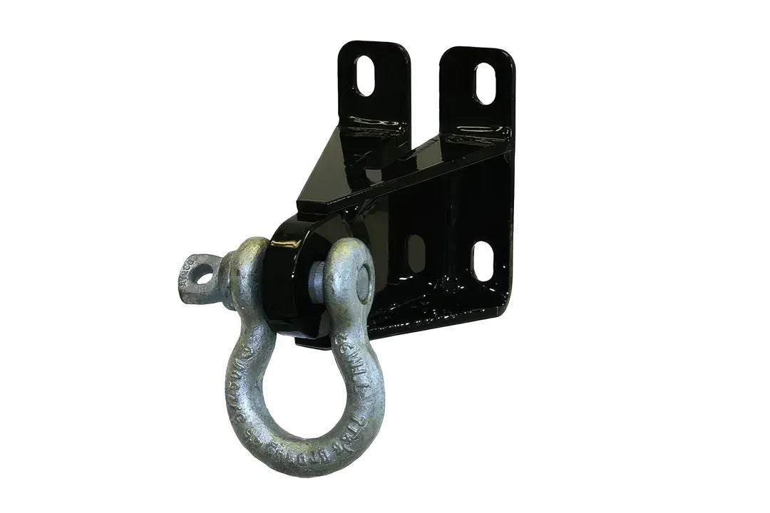 Fab Fours D-ring mount for Black Steel Ranch bumpers in gloss black, angled view, showing the slotted bolt-on mounting plate with a galvanized D-ring shackle pinned through the mount
