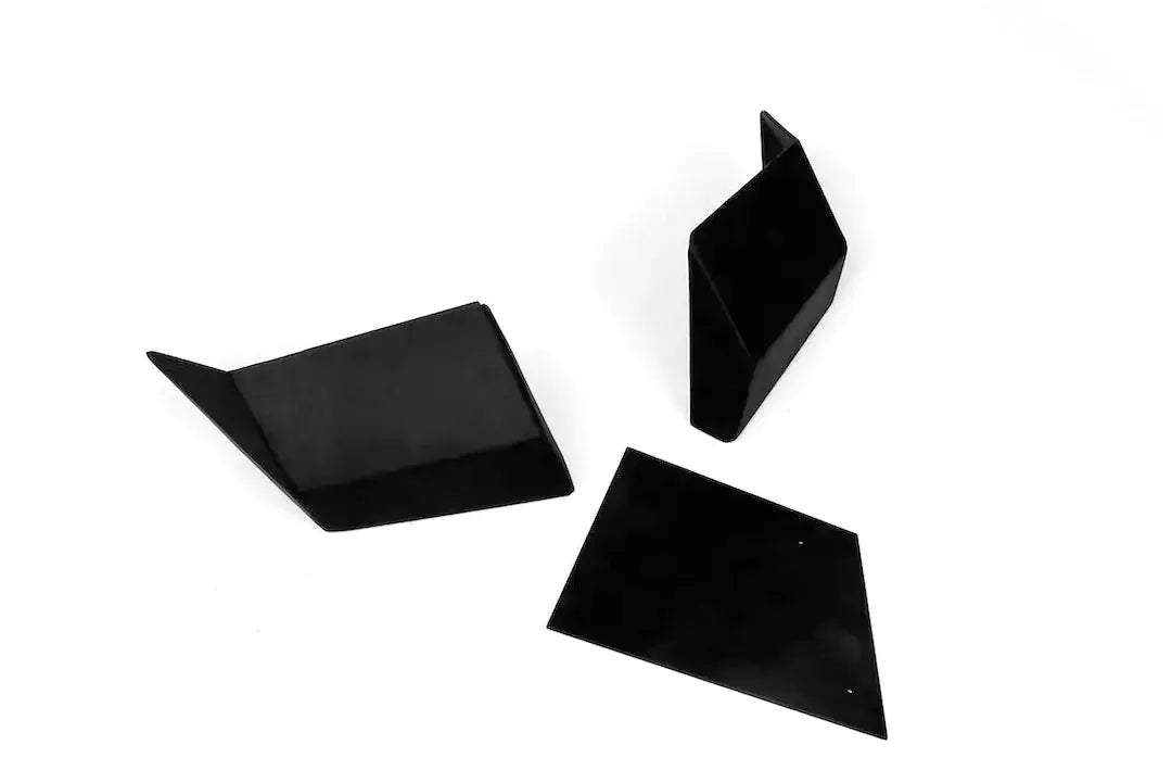 Fab Fours bumper extension caps in black powder coat, three-piece set of two angled end caps and one flat plate with mounting holes, shown on a white background