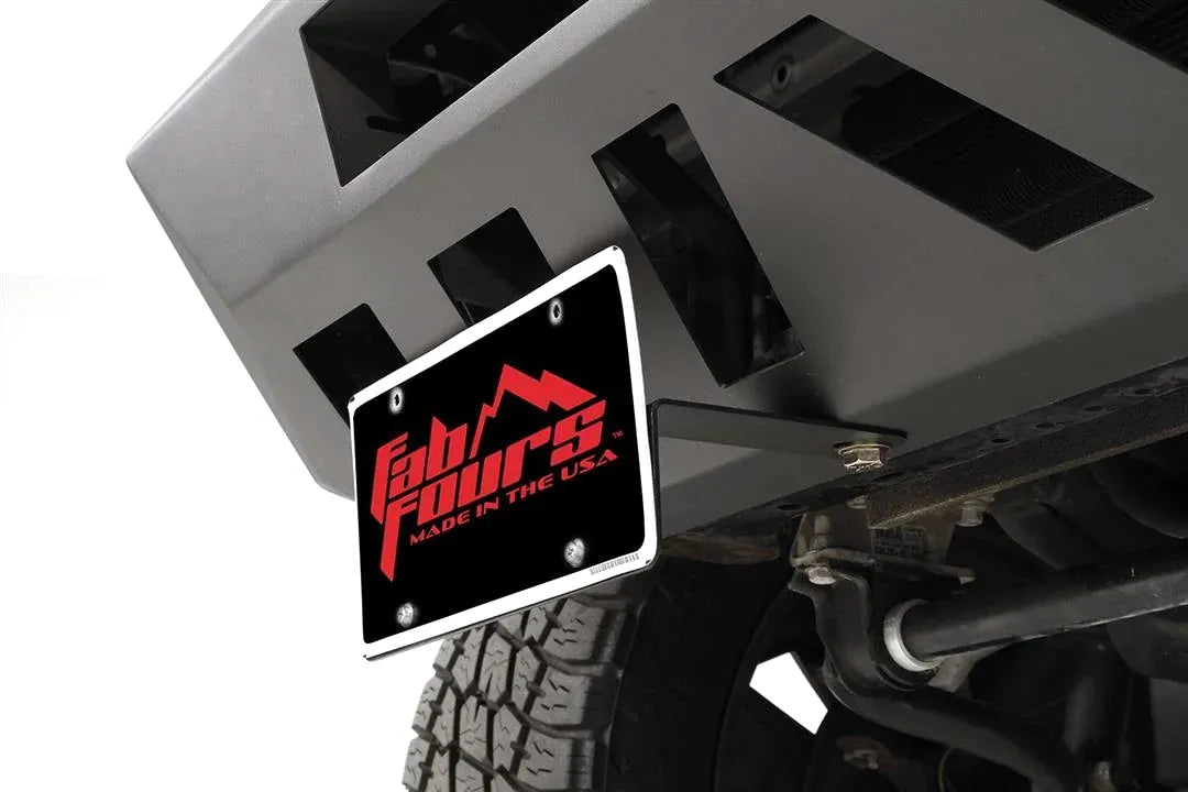 Close-up of Fab Fours license plate bracket holding a Fab Fours plate under a Vengeance front bumper