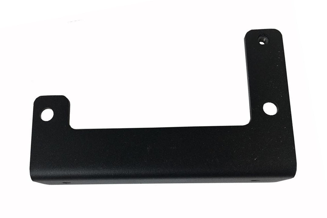 Fab Fours sensor relocation bracket for the Ford F-150, angled top view, showing the notched mounting arms, bolt holes and the welded nut on the upright tab