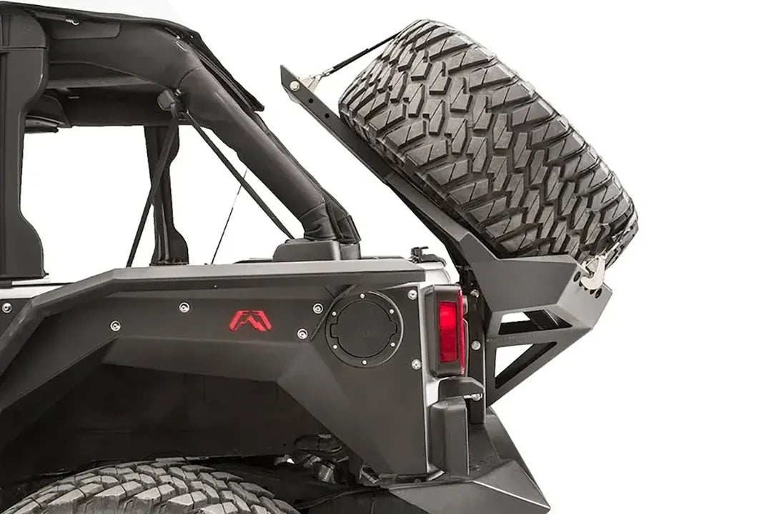 Close-up of the rear of a Jeep Wrangler JK with the Fab Fours tire carrier
