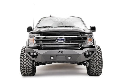 Fab Fours front bumper with adaptive cruise control relocation bracket on a lifted black Ford F-150, front view