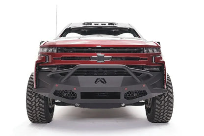 Textured black Fab Fours driving/fog light covers installed on a Vengeance bumper on a Chevrolet Silverado