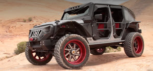 Fab Fours Mall Assault custom build with red wheels in the desert