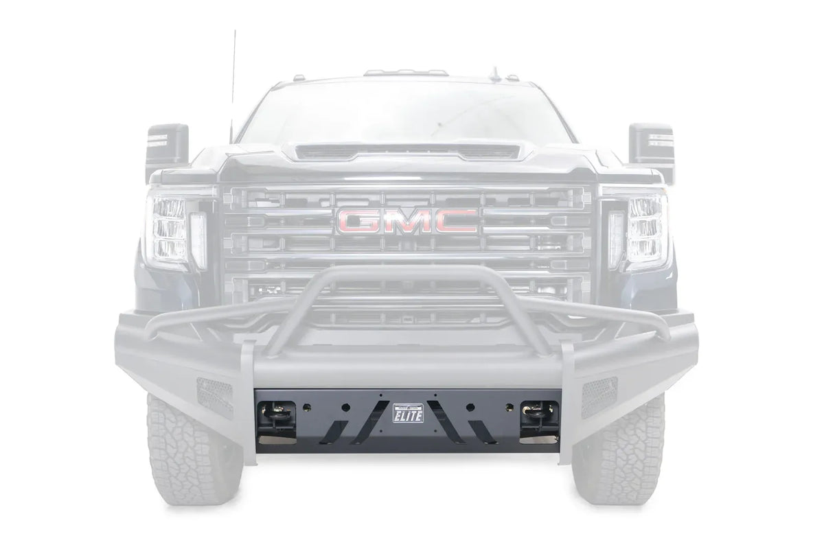 Fab Fours Elite replacement lower guard on a GMC Sierra 2500/3500 with an Elite front bumper and pre-runner guard, straight-on front view, with the guard highlighted in black against a faded truck, showing the angled slot cut-outs, Elite badge and shackle mount openings
