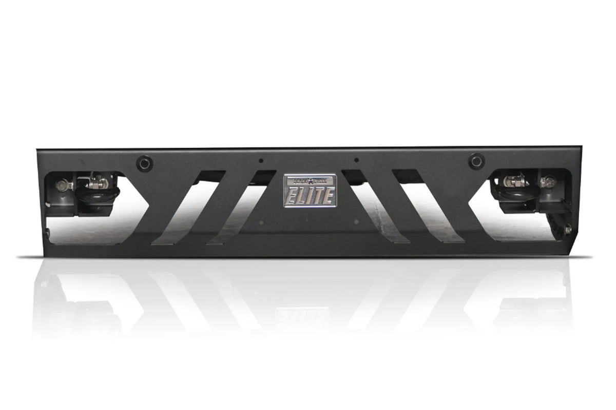 Fab Fours Black Steel Elite replacement lower guard for Chevrolet Silverado, front view on a white background, with slotted cutouts, parking sensor holes, tow hooks, and Black Steel Elite badge