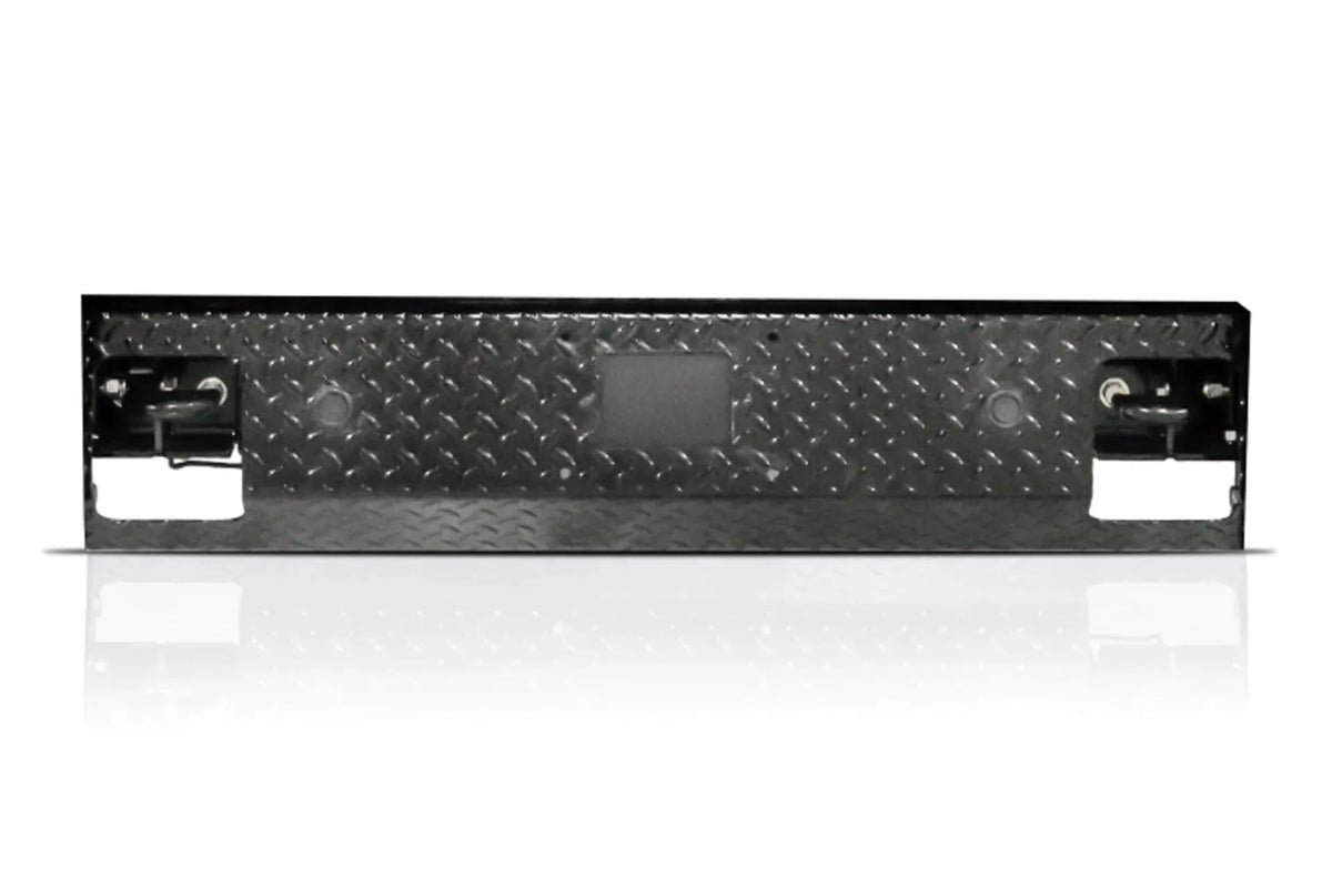 Fab Fours replacement lower guard for Ford Super Duty, solid black diamond tread plate panel with two sensor holes, a center cutout and D-ring shackles in each end pocket on a white background