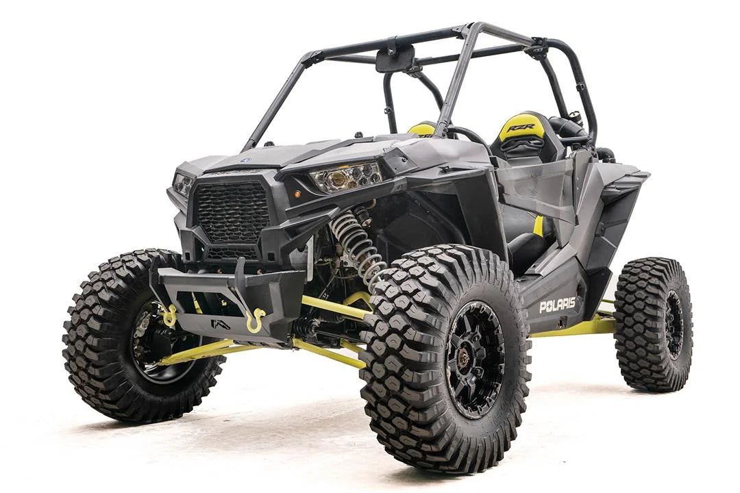 Fab Fours SxS winch bumper on a gray Polaris RZR XP with yellow accents, driver-side front three-quarter view, without winch installed