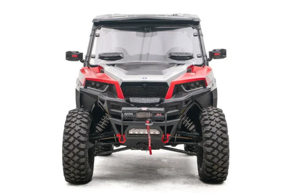 Fab Fours SxS winch bumper on a red Polaris General 1000, front view, with Warn Axon winch, LED light bar, and red D-ring shackles