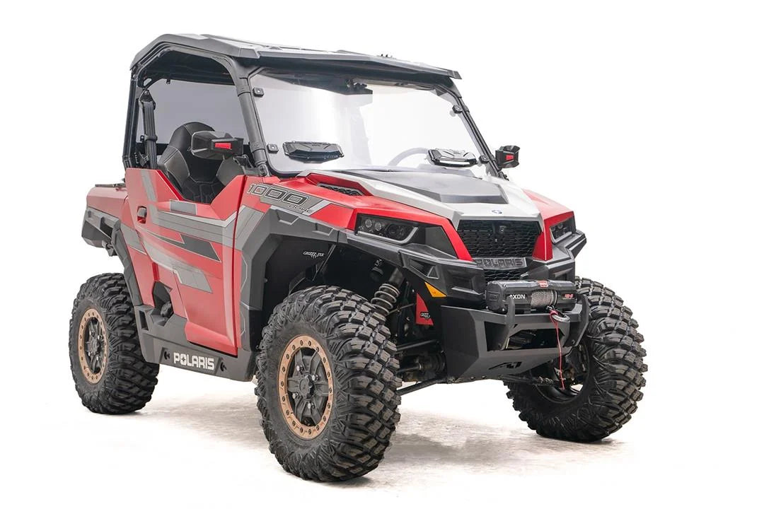 Fab Fours SxS winch bumper on a red Polaris General 1000, passenger-side front three-quarter view, with Warn Axon winch