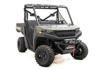Fab Fours SxS winch bumper on a green Polaris Ranger 1000, passenger-side front three-quarter view, with Warn Axon winch and LED light bar
