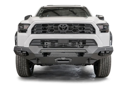 Fab Fours Matrix front winch bumper on a white Toyota 4Runner, straight-on front view, showing the full-width bumper, LED light bar and winch fairlead