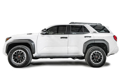 Fab Fours step slider on a white Toyota 4Runner TRD Off-Road, driver-side profile