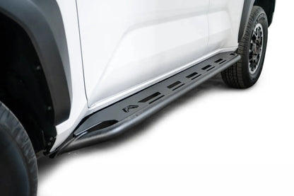 Fab Fours step slider on a white Toyota 4Runner, low angle along the rocker