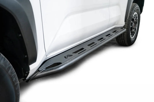 Fab Fours step slider on a white Toyota 4Runner, low angle along the rocker