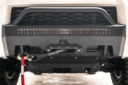 Fab Fours Hidden Winch Mount with low pre-runner guard on a white Toyota 4Runner, close-up of the lower front, showing the pre-runner hoop, LED light bar and winch fairlead