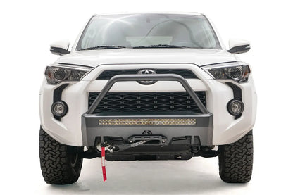 Fab Fours Hidden Winch Mount with high pre-runner guard on a white Toyota 4Runner, front view, showing the high pre-runner hoop, LED light bar and winch fairlead