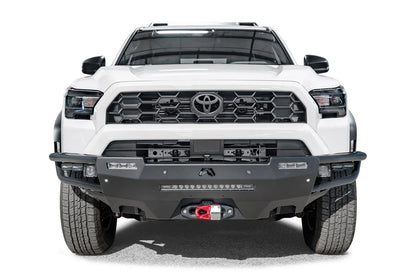 Fab Fours Hybrid front bumper on a white Toyota 4Runner, front view, showing the tube wings, LED light bar and red winch shackle mount