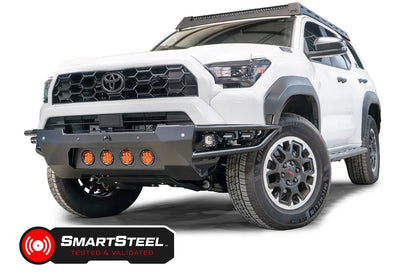 Fab Fours Ultra Light Front Bumper with no guard on a white 2025 Toyota 4Runner, front driver-side view, showing the SmartSteel Tested and Validated badge