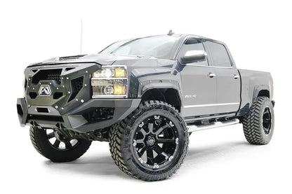 Fab Fours Open Fender Flares on a gray Chevrolet 2500HD, front three-quarter view from the driver side, showing the open front fender flare, bolt detail and tire clearance