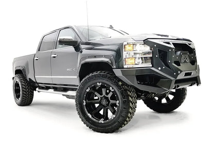 Fab Fours Open Fender Flares on a gray Chevrolet 2500HD, front three-quarter view from the passenger side, showing the open front fender flare, bolt detail and tire clearance