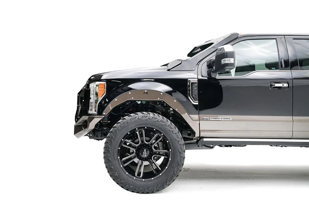 Fab Fours Open Fender System on a black Ford F-250 Super Duty, close-up of the front fender, showing the open front fender, bolt-on trim and tire clearance