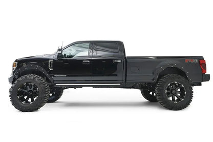 Fab Fours Open Fender System on a black Ford F-250 Super Duty, driver-side profile view, showing the open front and rear fenders and raised wheel openings