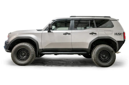 Fab Fours Rock Step slider on a silver Toyota Land Cruiser, driver-side profile