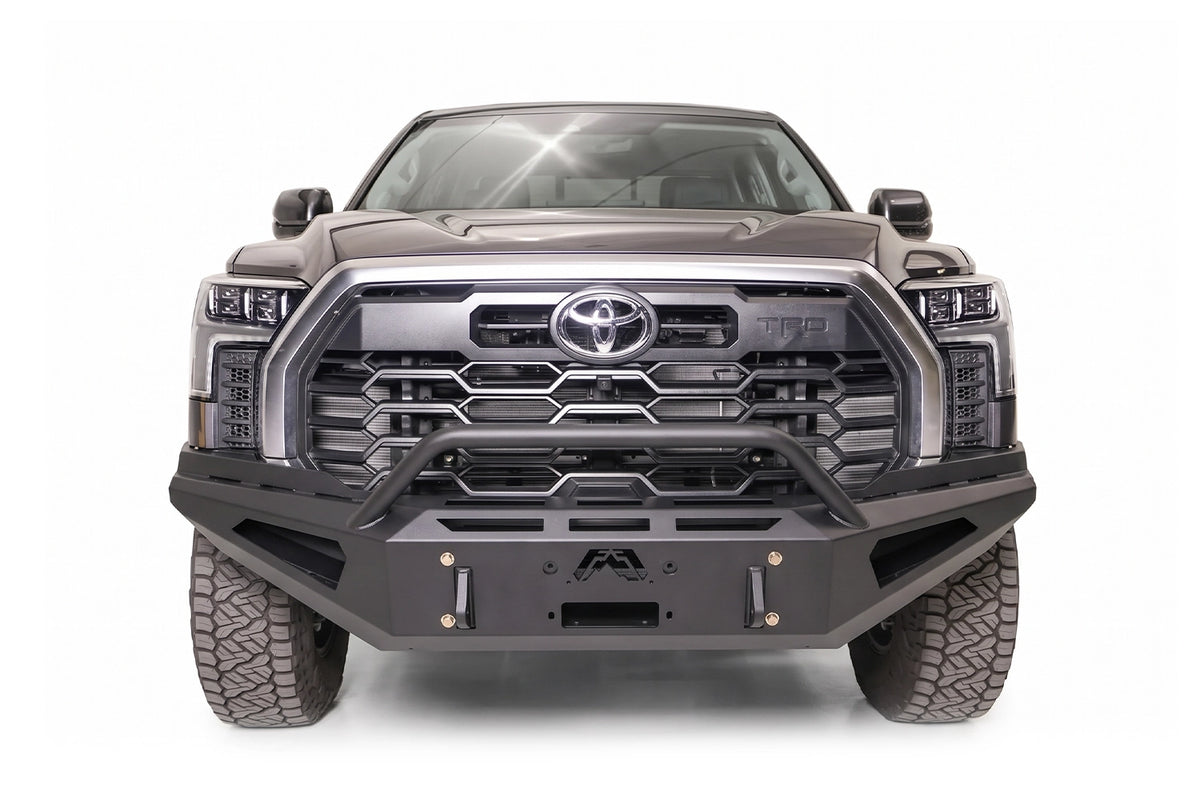 Fab Fours Red Steel front bumper with pre-runner guard on a gray Toyota Tundra TRD