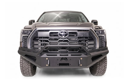 Fab Fours Red Steel front bumper with pre-runner guard on a gray Toyota Tundra TRD