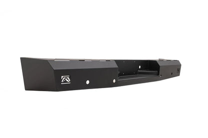 Fab Fours Red Steel rear bumper for the Toyota Tundra, angled view from the driver-side end, showing the faceted end cap, the Fab Fours logo cut-outs and the recessed step with its mounting holes