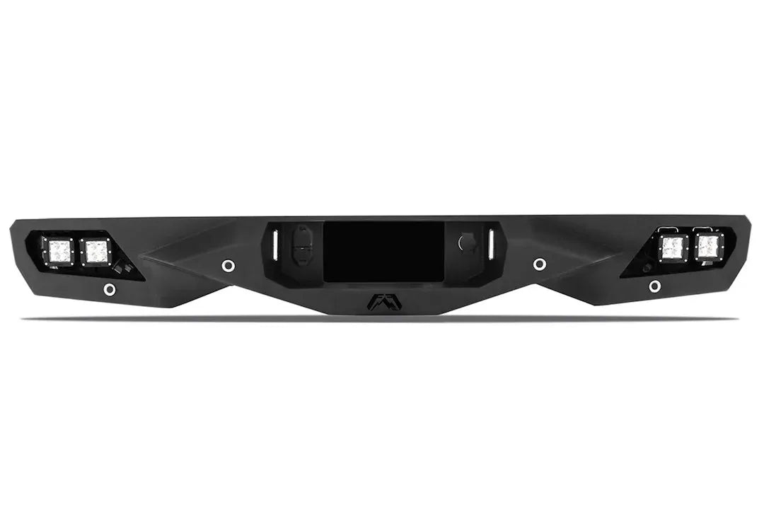 Fab Fours Vengeance rear bumper in black powder coat, rear view, showing the integrated cube light pods, center hitch opening, and angular faceted face