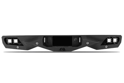Fab Fours Vengeance rear bumper in black powder coat, rear view, showing the integrated cube light pods, center hitch opening, and angular faceted face