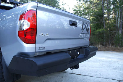 Fab Fours Black Steel Elite rear bumper on a Toyota Tundra, outdoor view