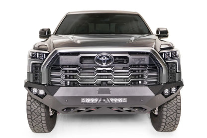 Fab Fours Vengeance front bumper on a gray Toyota Tundra, straight-on front view, showing the no-guard design, LED light bar, and cube light pods