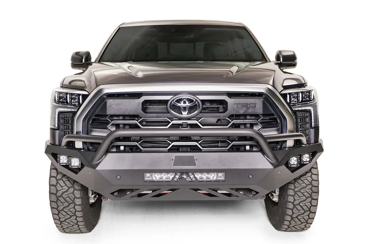 Fab Fours Vengeance front bumper with pre-runner guard on a gray Toyota Tundra, straight-on front view, showing the pre-runner hoop, LED light bar, and cube light pods