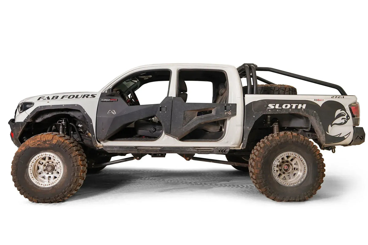 Fab Fours sport rack on a lifted white Toyota Tacoma with Fab Fours doors and bed-side armor, driver-side profile view