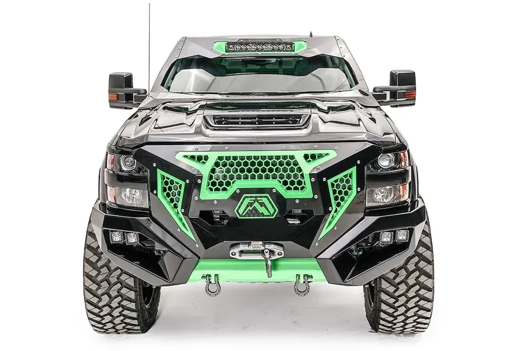 Fab Fours ViCowl on a black and green wrapped Chevrolet Silverado 2500 HD, straight-on front view, showing the windshield frame cover, LED light bar, and cowl shape