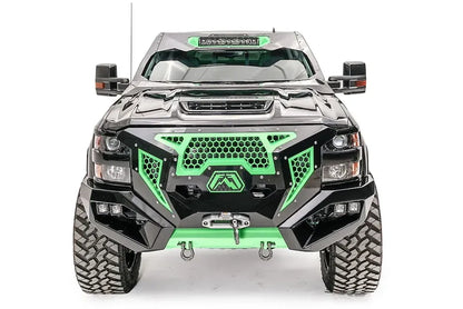 Fab Fours ViCowl on a black and green wrapped Chevrolet Silverado 2500 HD, straight-on front view, showing the windshield frame cover, LED light bar, and cowl shape