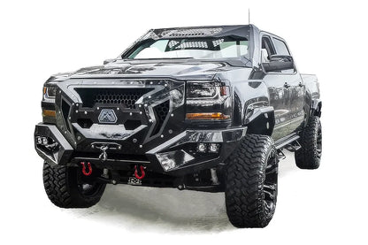 Fab Fours ViCowl on a black Chevrolet Silverado 1500, front three-quarter view, showing the windshield frame cover, honeycomb mesh vent, and A-pillar wrap