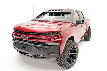 Fab Fours ViCowl on a red Chevrolet Silverado 1500, front three-quarter view, showing the windshield frame cover, light pods, and A-pillar wrap