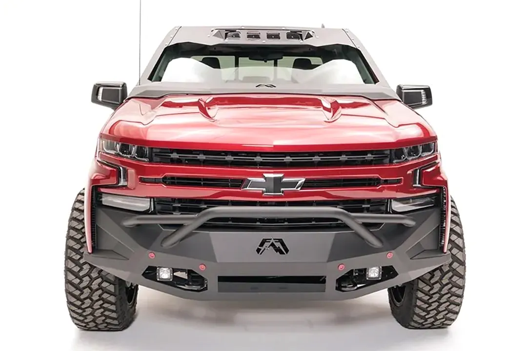 Fab Fours ViCowl on a red Chevrolet Silverado 1500, straight-on front view, showing the windshield frame cover, light pods, and cowl shape
