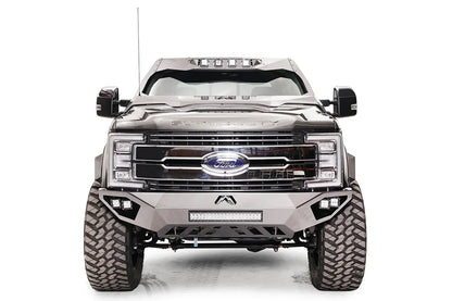 Fab Fours ViCowl on a gray Ford Super Duty, front view, showing the steel cowl wrapping the windshield frame with four roof-mounted cube lights above a Fab Fours front bumper