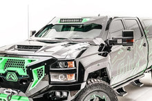 Fab Fours ViCowl 20-inch light bar insert on a black Chevrolet Silverado HD with green accents, front driver-side view, showing the light bar mounted at the top of the ViCowl windshield frame