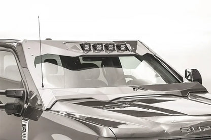Fab Fours ViCowl four-light insert on a gray Ford Super Duty, front driver-side view, showing four cube pod lights mounted across the top of the ViCowl windshield frame